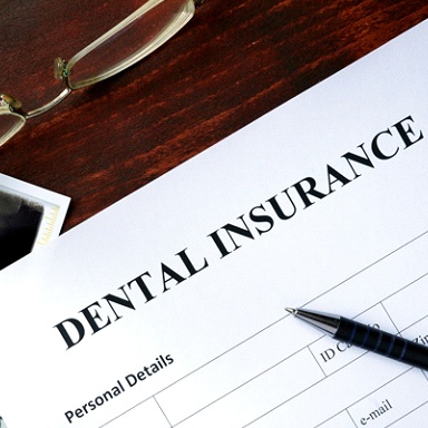 A dental insurance claim on a table.